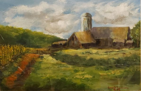 A barn by a cornfield